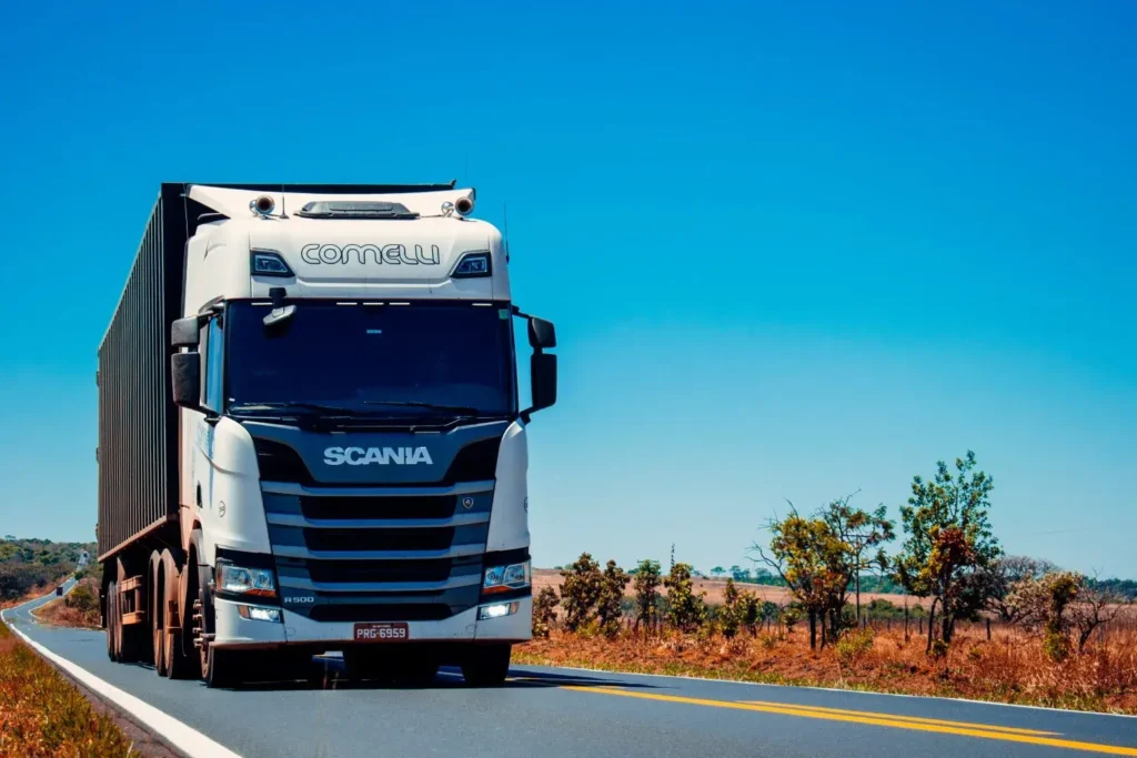 Scania truck on a road with a blue sky