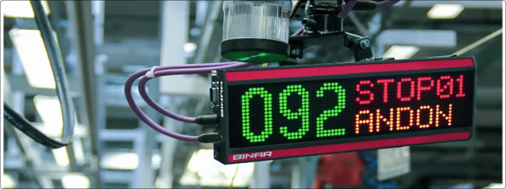 Binar LED display with connected cables in factory environment