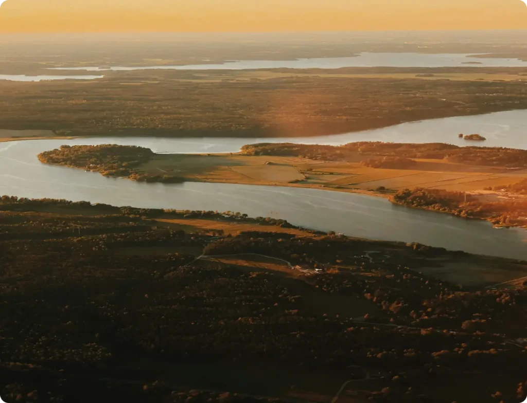 Drone view of a landscape with water and nature in sunset light