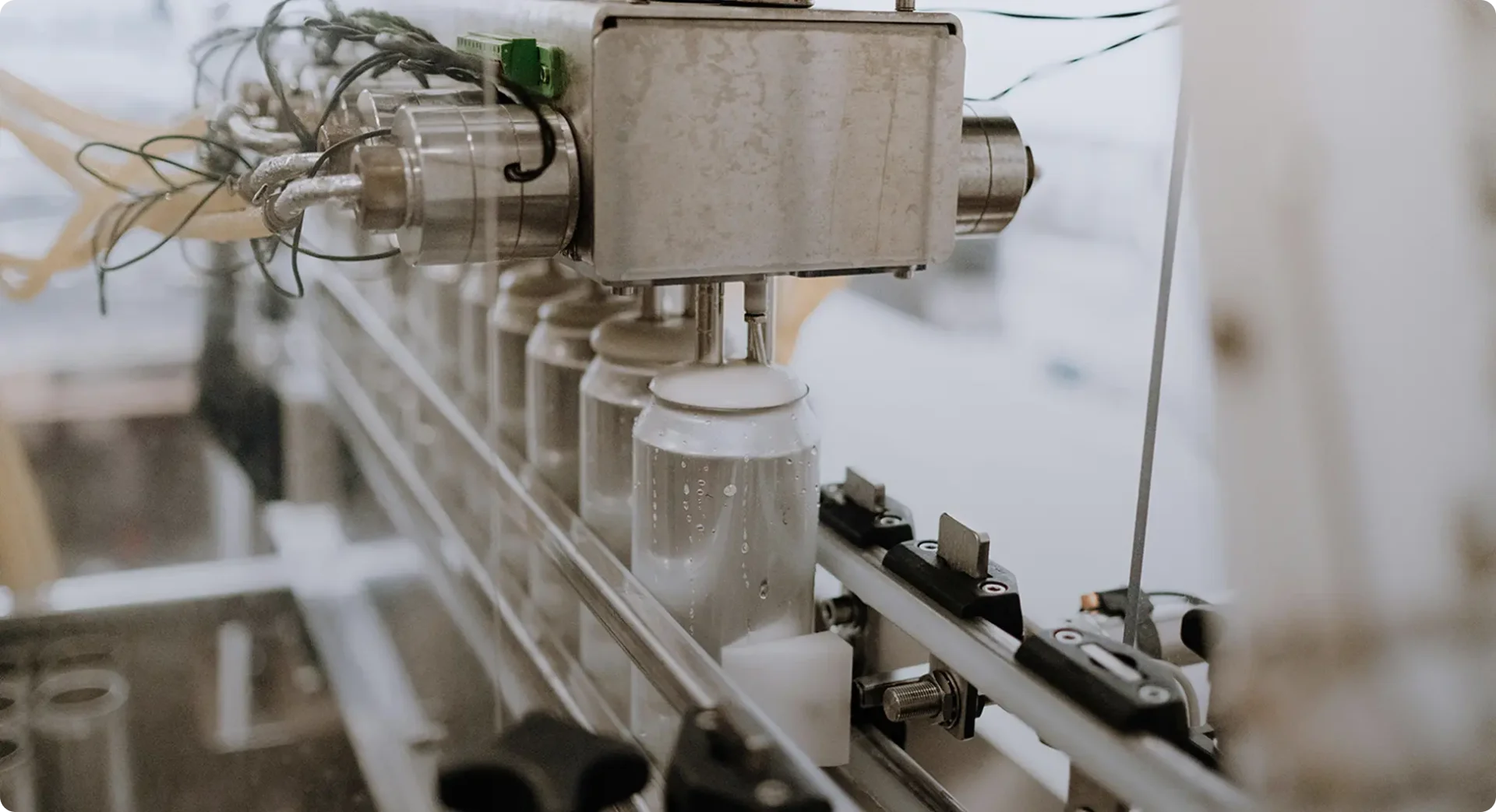Machine on a production line filling aluminum cans