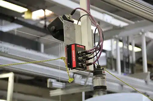 Binar device with connected cables in a production environment